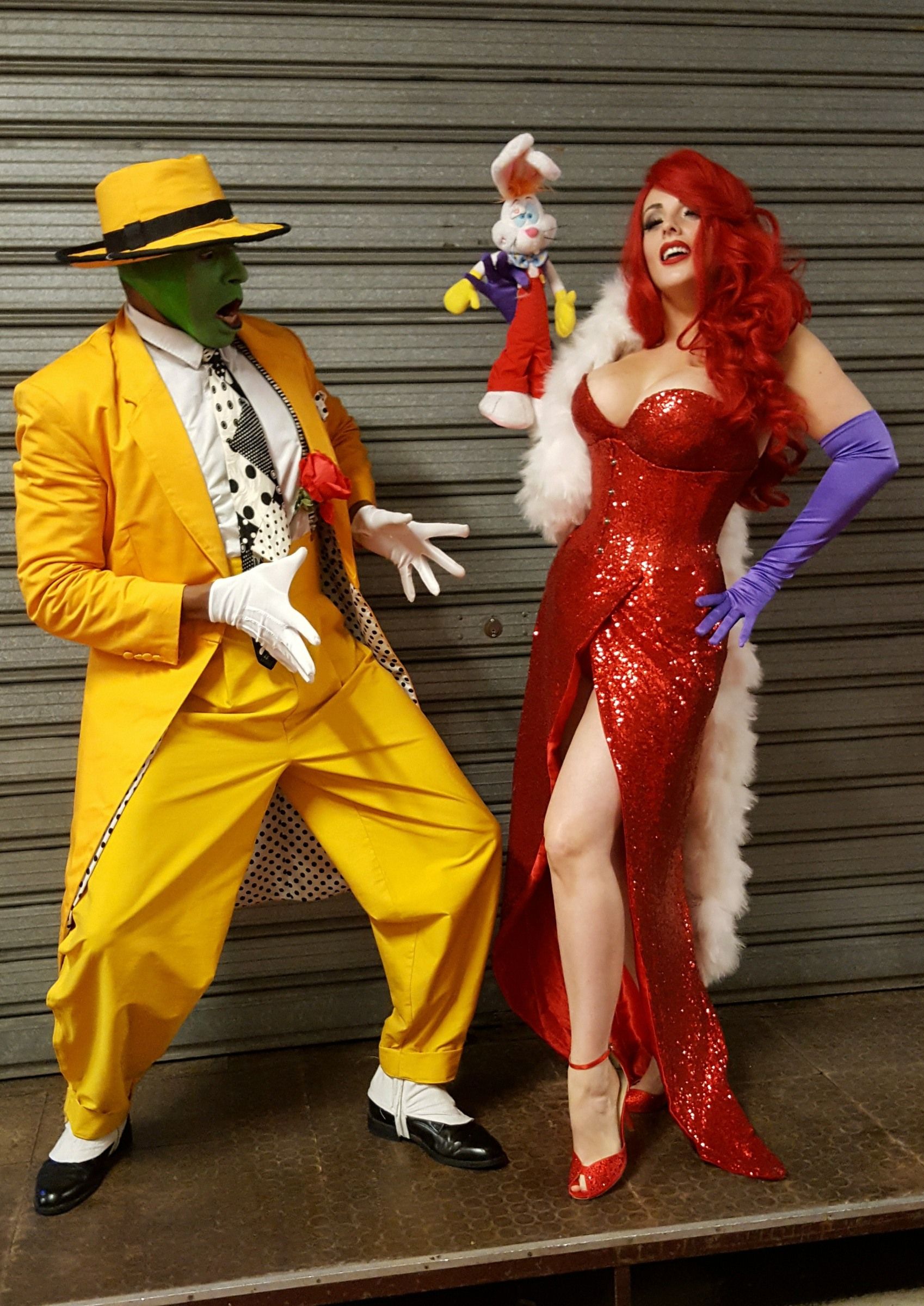 Jessica Rabbit dress up act with roger rabbit toy character and man dressed in yellow cartoon outfit with green face mask