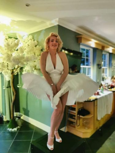 marilyn monroe wind gust pose in domestic kitchen setting